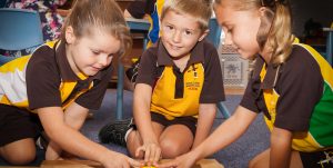 Learning in a Lutheran school. Male and female prep students working together